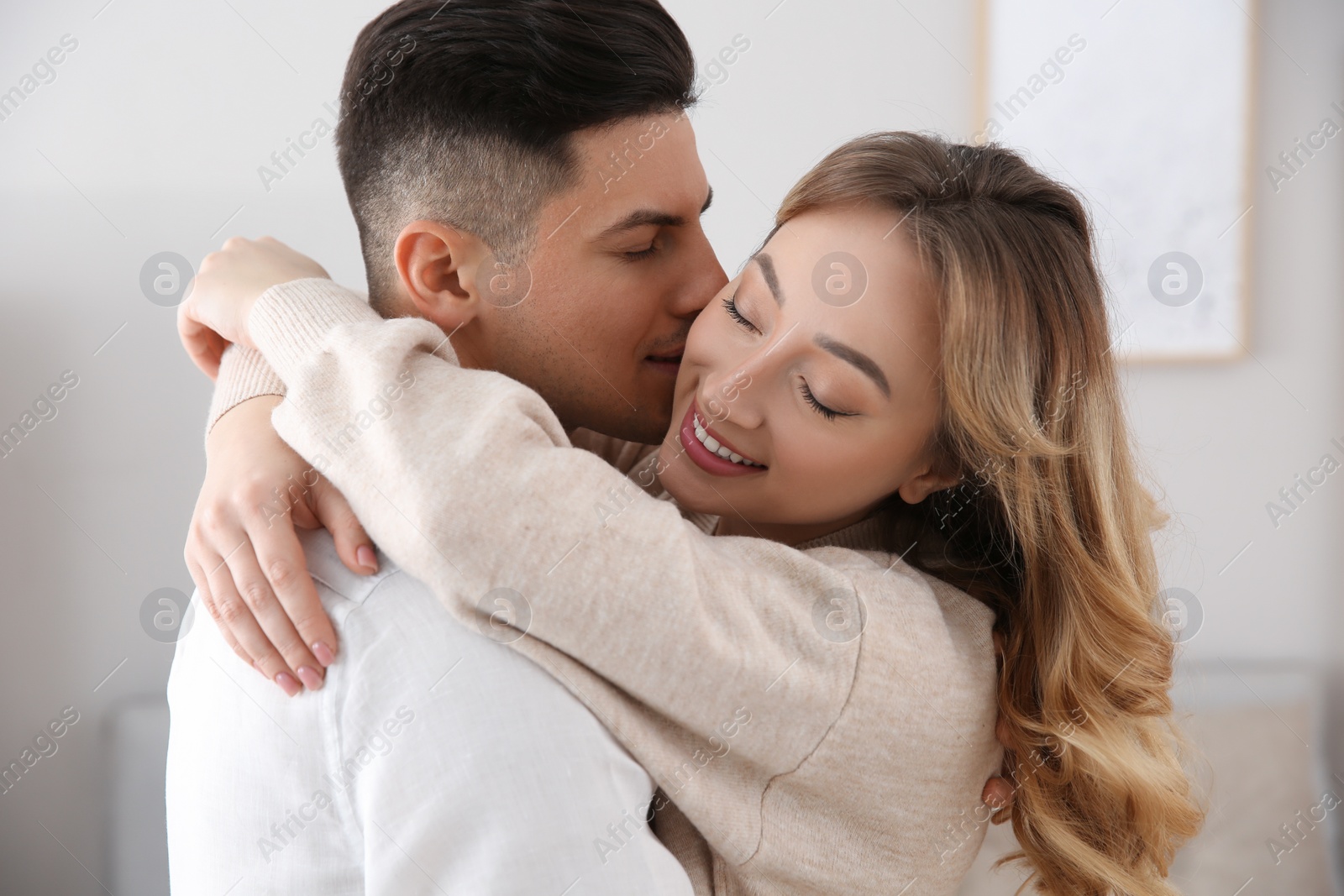 Photo of Lovely couple enjoying time together at home