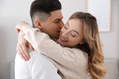 Photo of Lovely couple enjoying time together at home