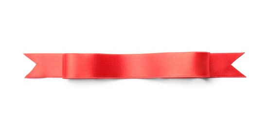 Photo of Simple red ribbon on white background, top view. Festive decoration