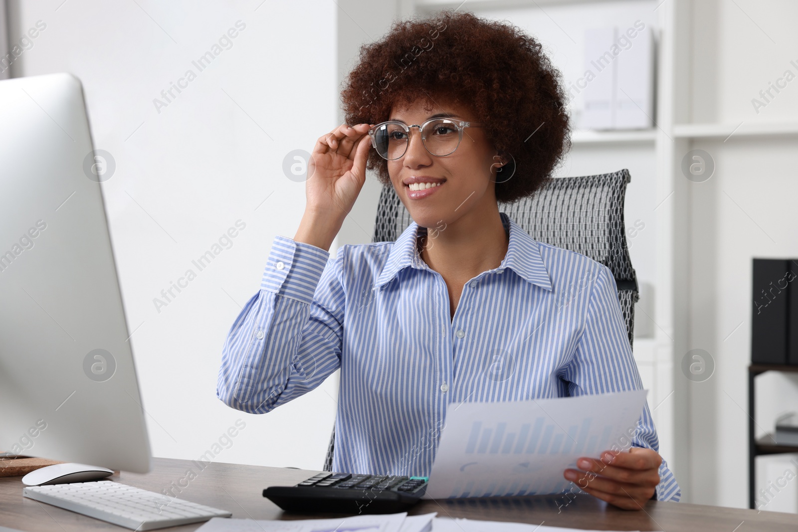 Photo of Professional accountant working at wooden desk in office