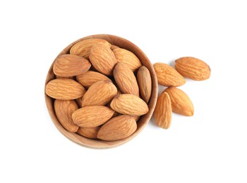 Photo of Wooden bowl and organic almond nuts on white background, top view. Healthy snack