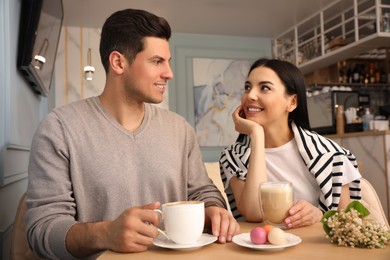 Lovely couple on date at cafe in morning