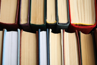 Photo of Many different hardcover books as background, top view