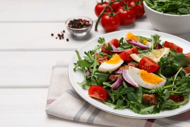 Photo of Delicious salad with boiled eggs, vegetables and bacon on white wooden table, closeup. Space for text