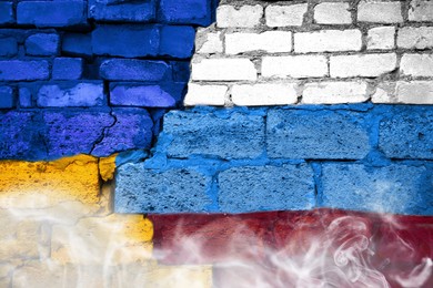 Image of Russian-Ukrainian war. Wall painted in colors of national flags