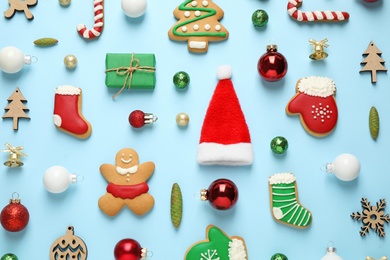 Photo of Flat lay composition with Christmas decorations on light blue background