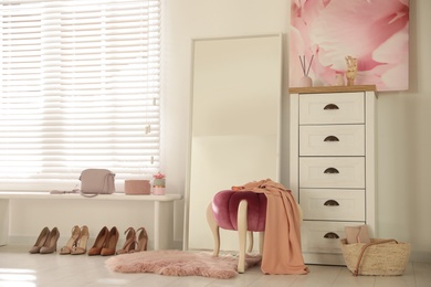 Photo of Stylish large mirror in modern dressing room interior