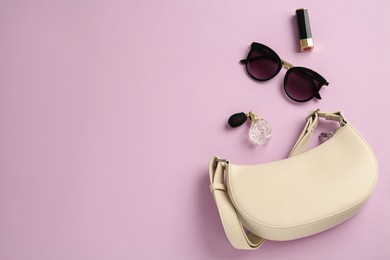 Photo of Flat lay composition with stylish baguette handbag on lilac background. Space for text