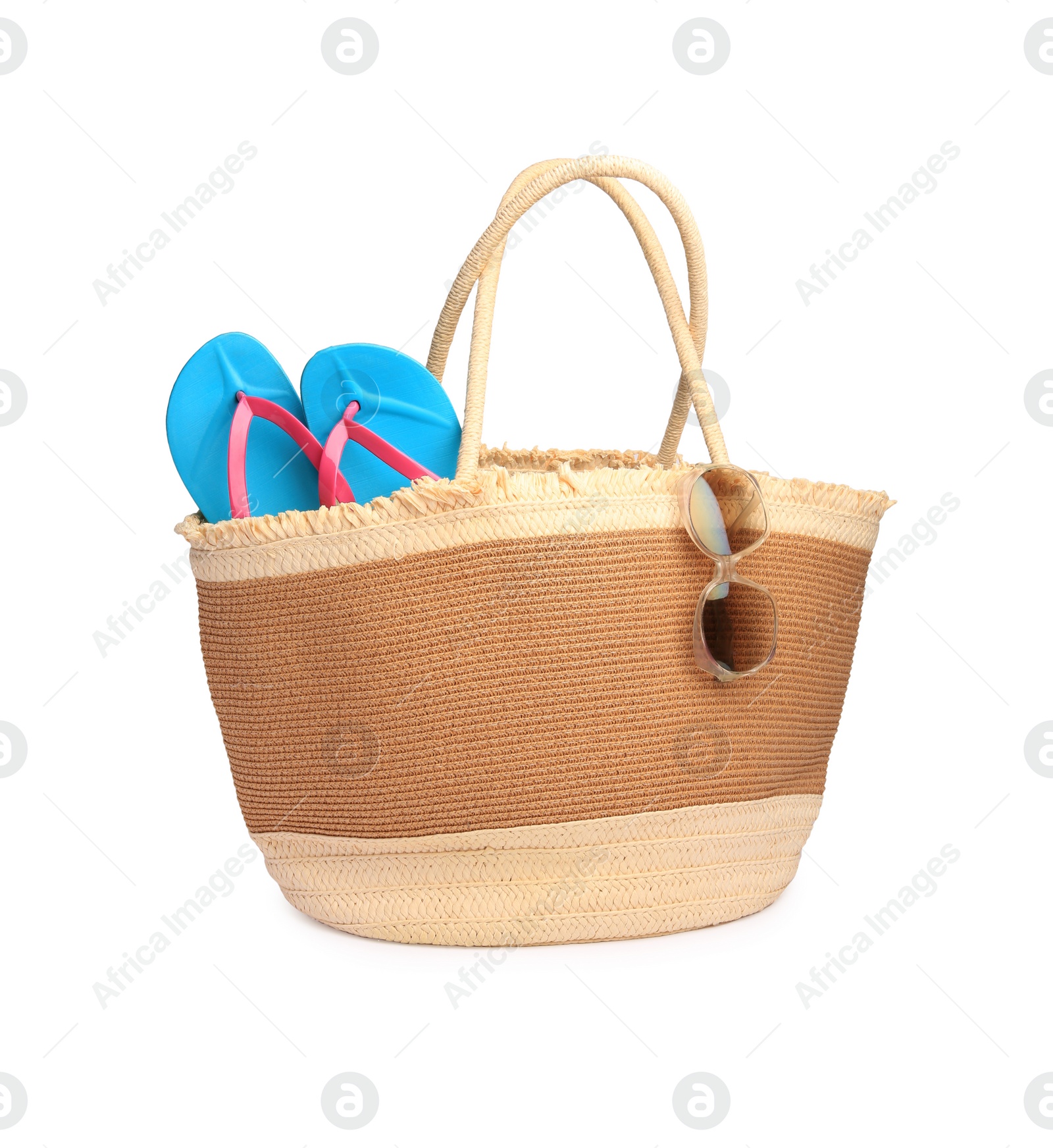Photo of Stylish straw bag with beach objects isolated on white