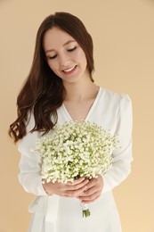 Photo of Happy bride with beautiful bouquet indoors. Wedding day