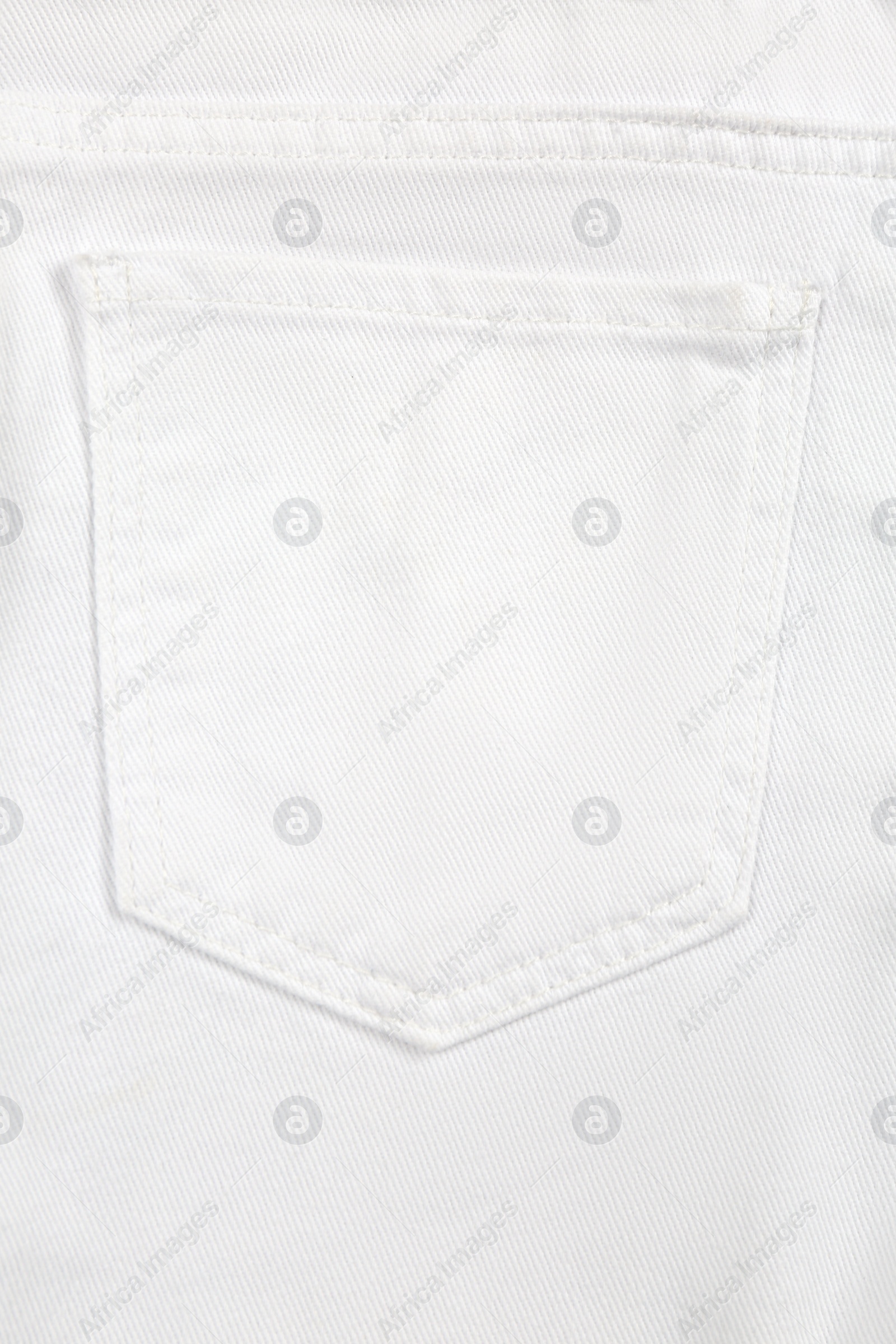 White jeans with back pocket as background, closeup Photo of White jeans with back pocket as background, closeup