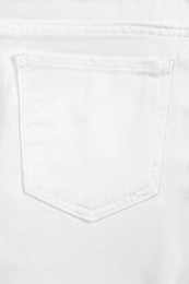 Photo of White jeans with back pocket as background, closeup