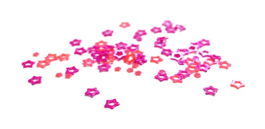 Photo of Colorful sequins in shape of stars isolated on white