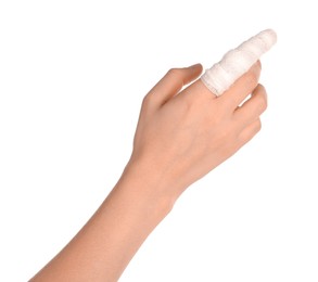 Photo of Woman with finger wrapped in medical bandage on white background, closeup