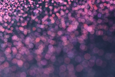 Photo of Magic pink bokeh effect on dark background