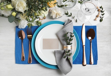 Photo of Elegant festive table setting on white wooden background, flat lay