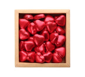 Photo of Heart shaped chocolate candies in box on white background, top view