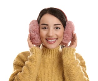 Photo of Beautiful young woman wearing earmuffs on white background