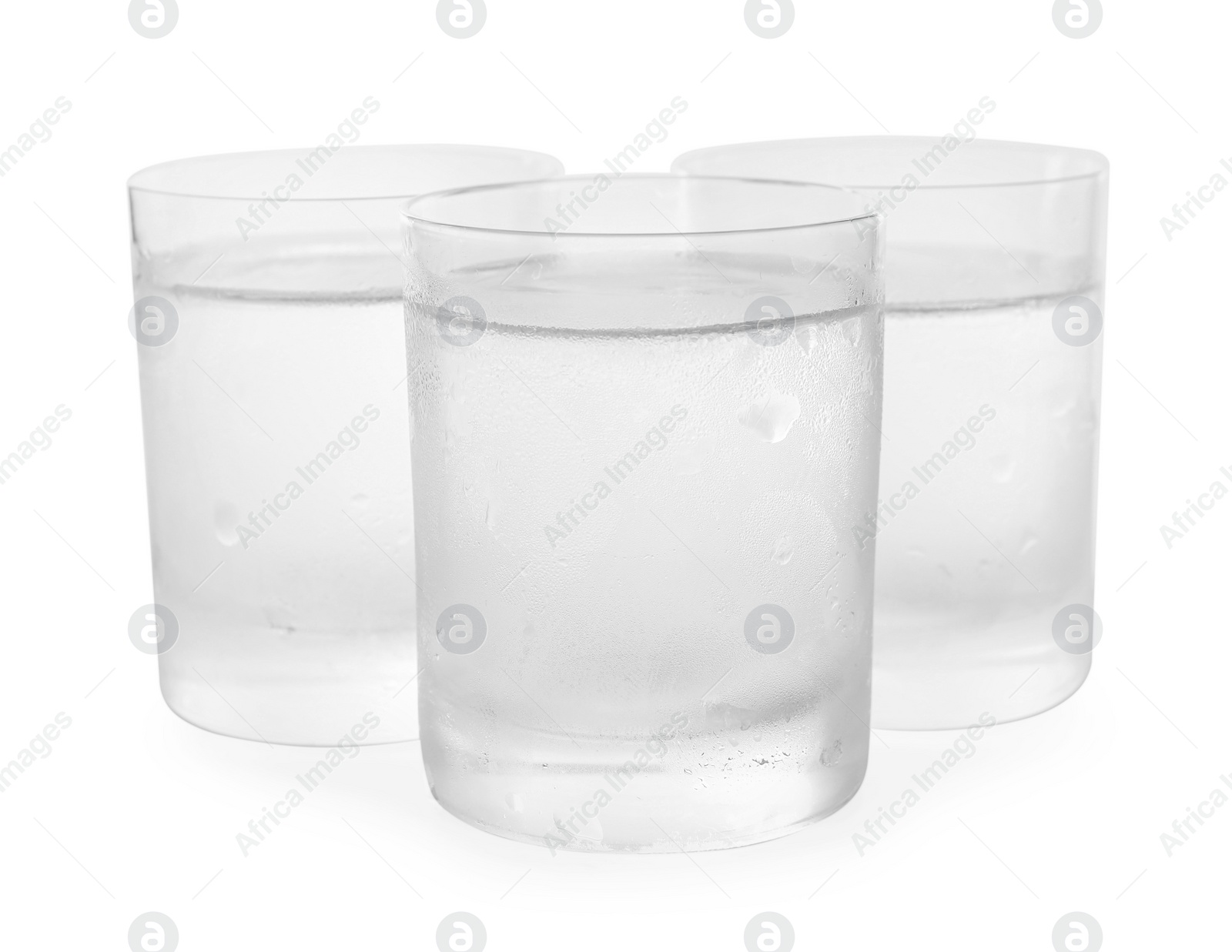 Photo of Vodka in shot glasses on white background