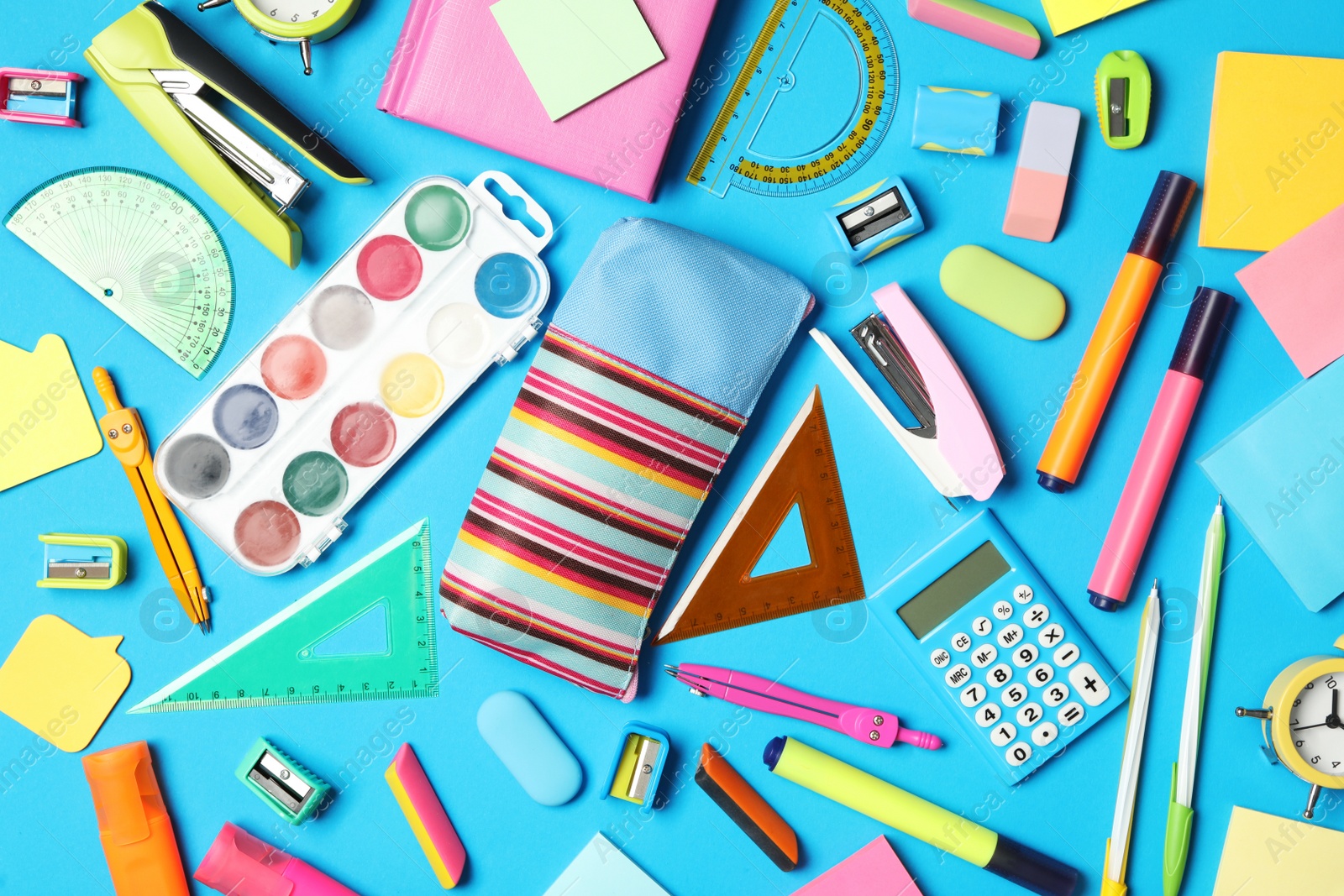 Photo of Different stationery on light blue background, flat lay. Back to school