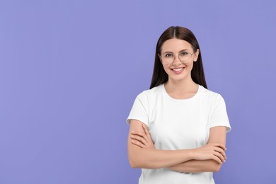 Smiling woman in stylish eyeglasses on violet background. Space for text