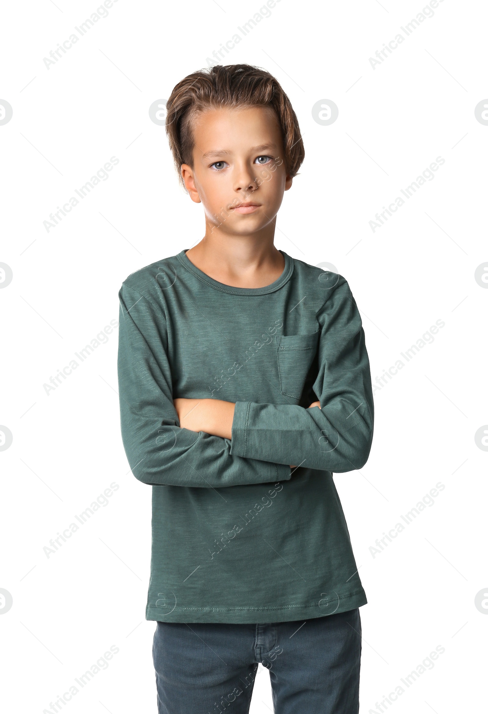 Photo of Portrait of cute little boy in casual outfit on white background