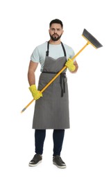 Photo of Young man with yellow broom on white background