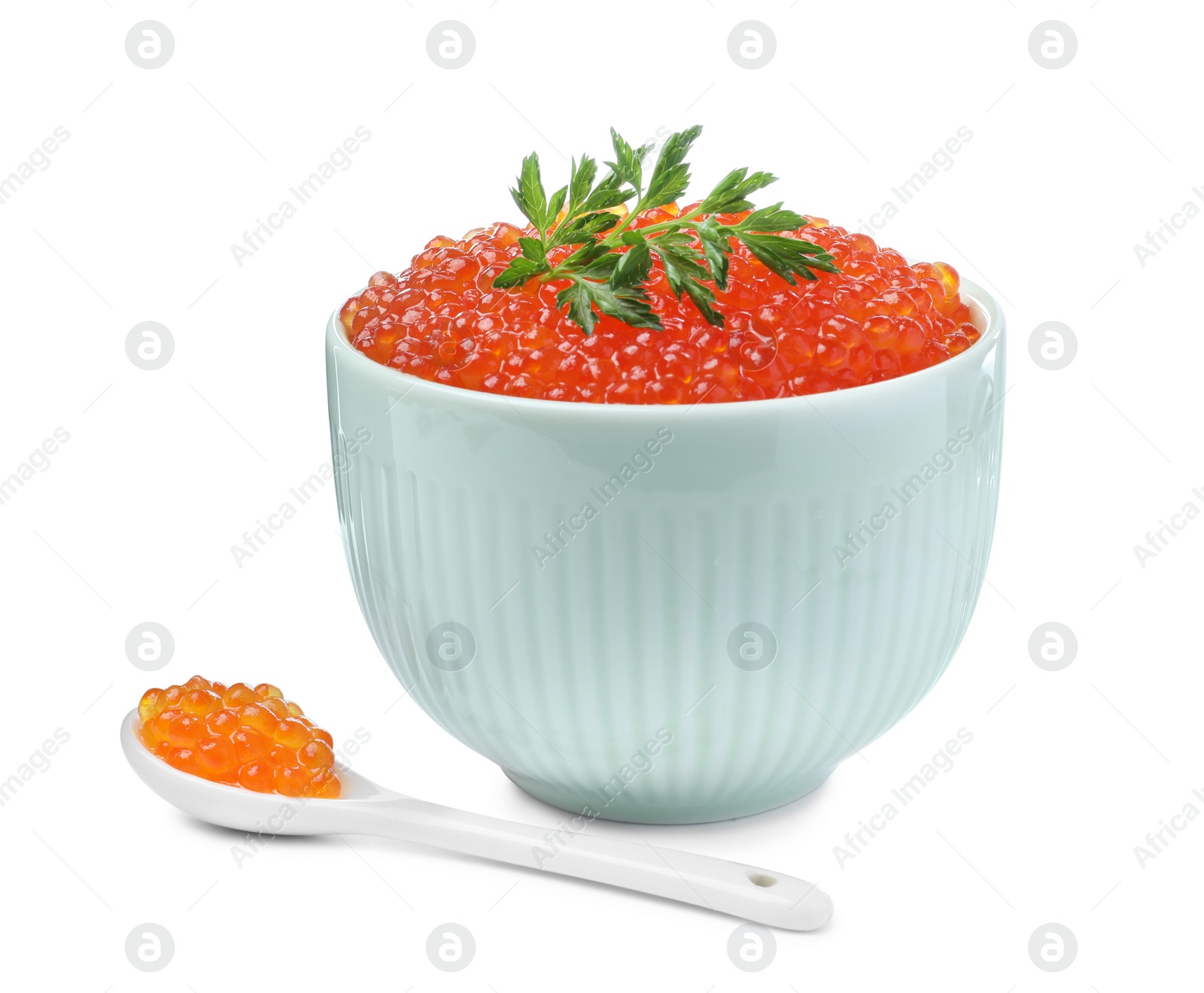 Photo of Delicious red caviar and parsley on white background