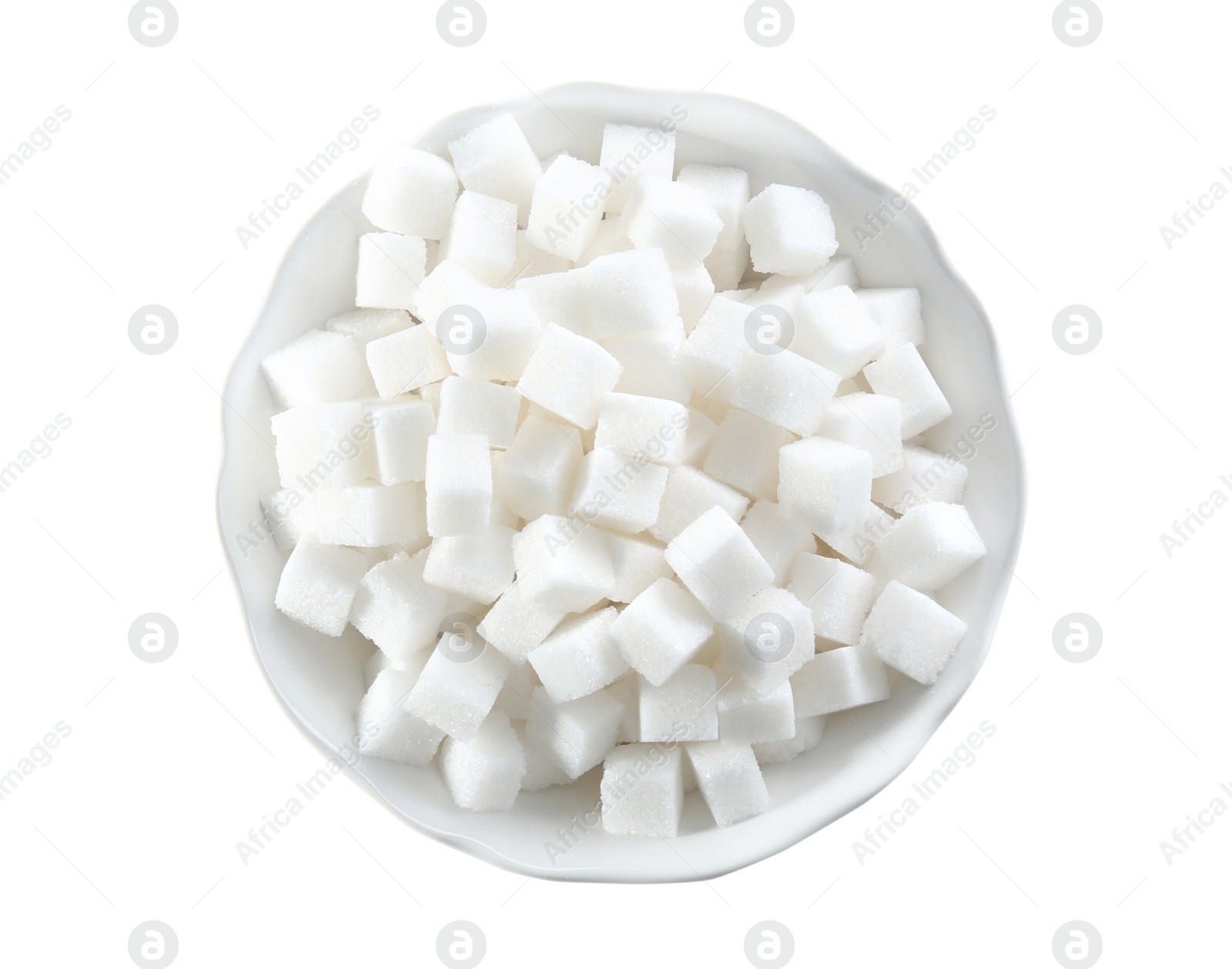 Photo of Refined sugar cubes in bowl on white background, top view
