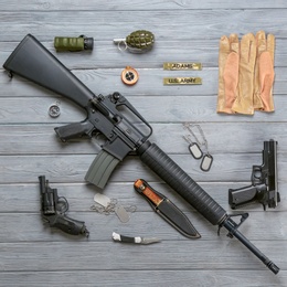 Set of military equipment on wooden background, flat lay