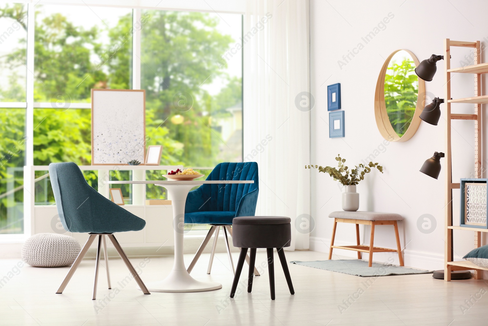 Photo of Modern dining room interior with table and chairs