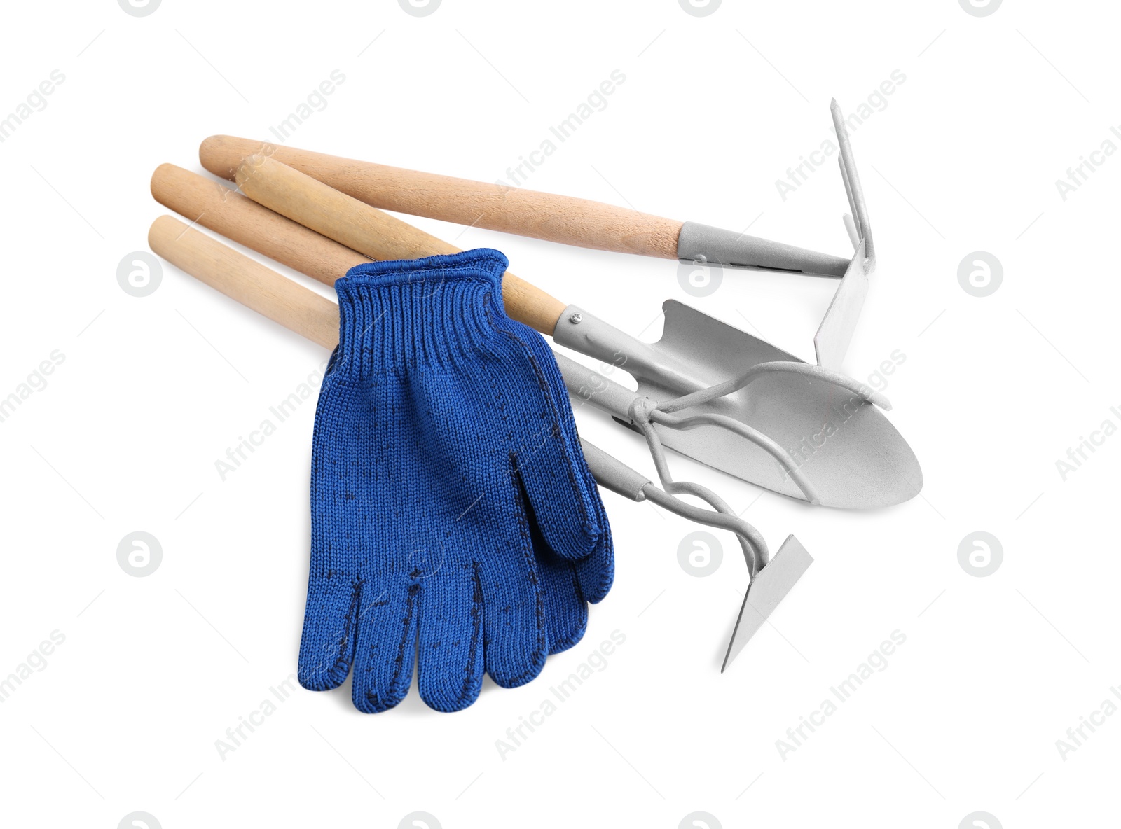 Photo of Pair of gloves and gardening tools on white background, top view