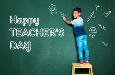 Image of Cute little child drawing ruler near phrase Happy Teacher's Day on chalkboard