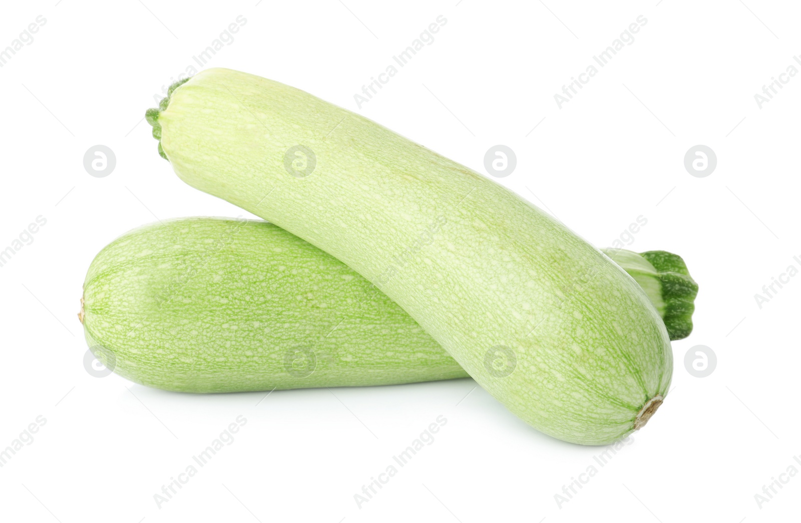 Photo of Raw green ripe zucchinis isolated on white