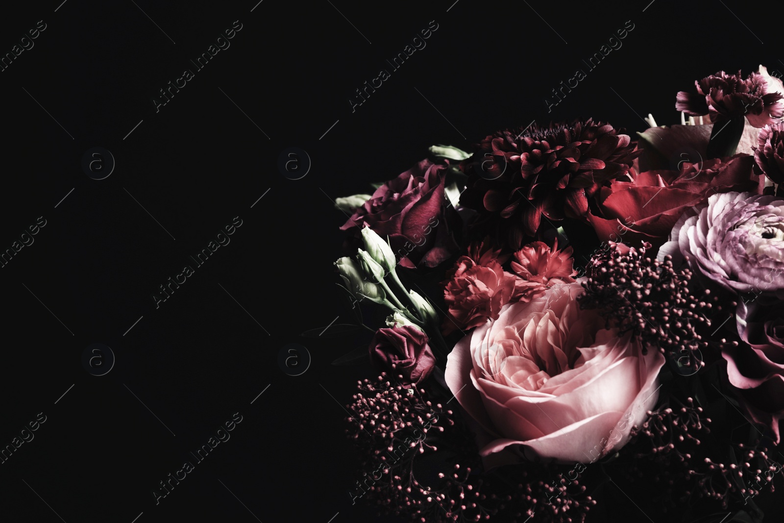 Photo of Beautiful bouquet of different flowers on black background, space for text. Floral card design with dark vintage effect