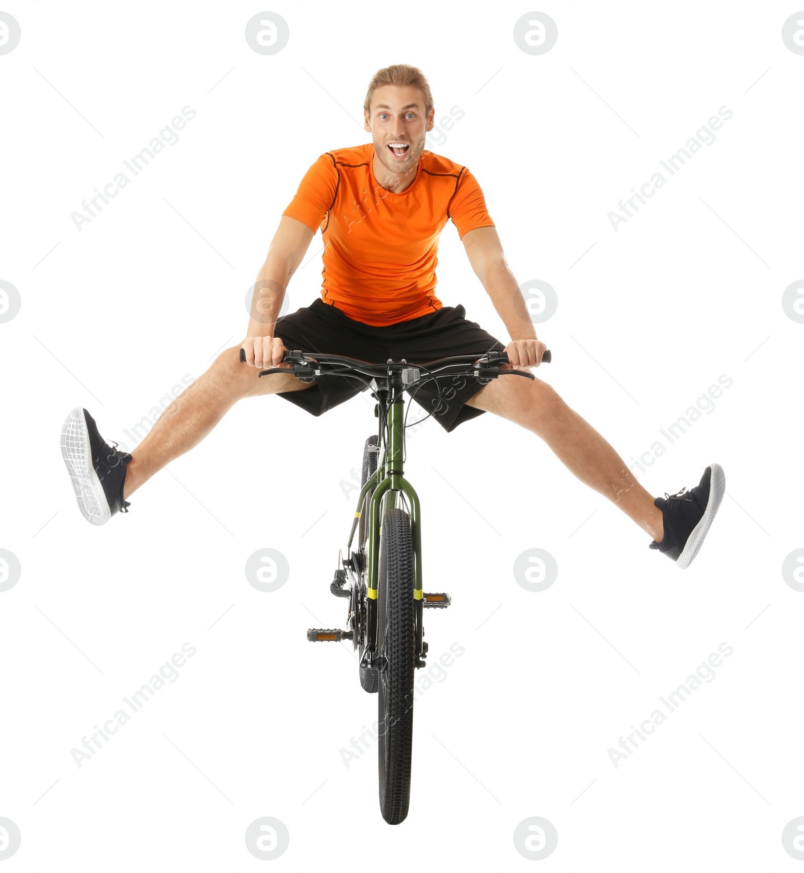 Photo of Happy young man riding bicycle on white background