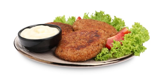 Photo of Plate with delicious vegan cutlets, lettuce, tomato and sauce isolated on white
