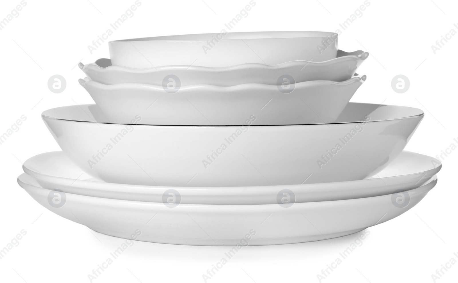 Photo of Stack of clean ceramic dishware isolated on white