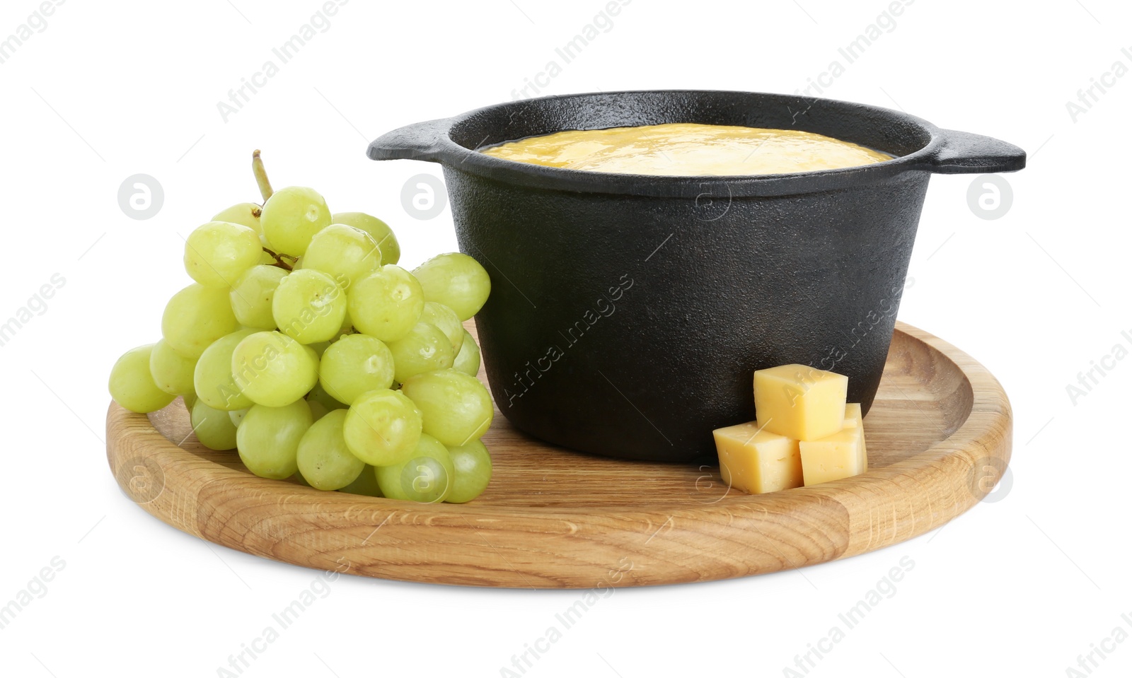 Photo of Fondue with tasty melted cheese and grapes isolated on white