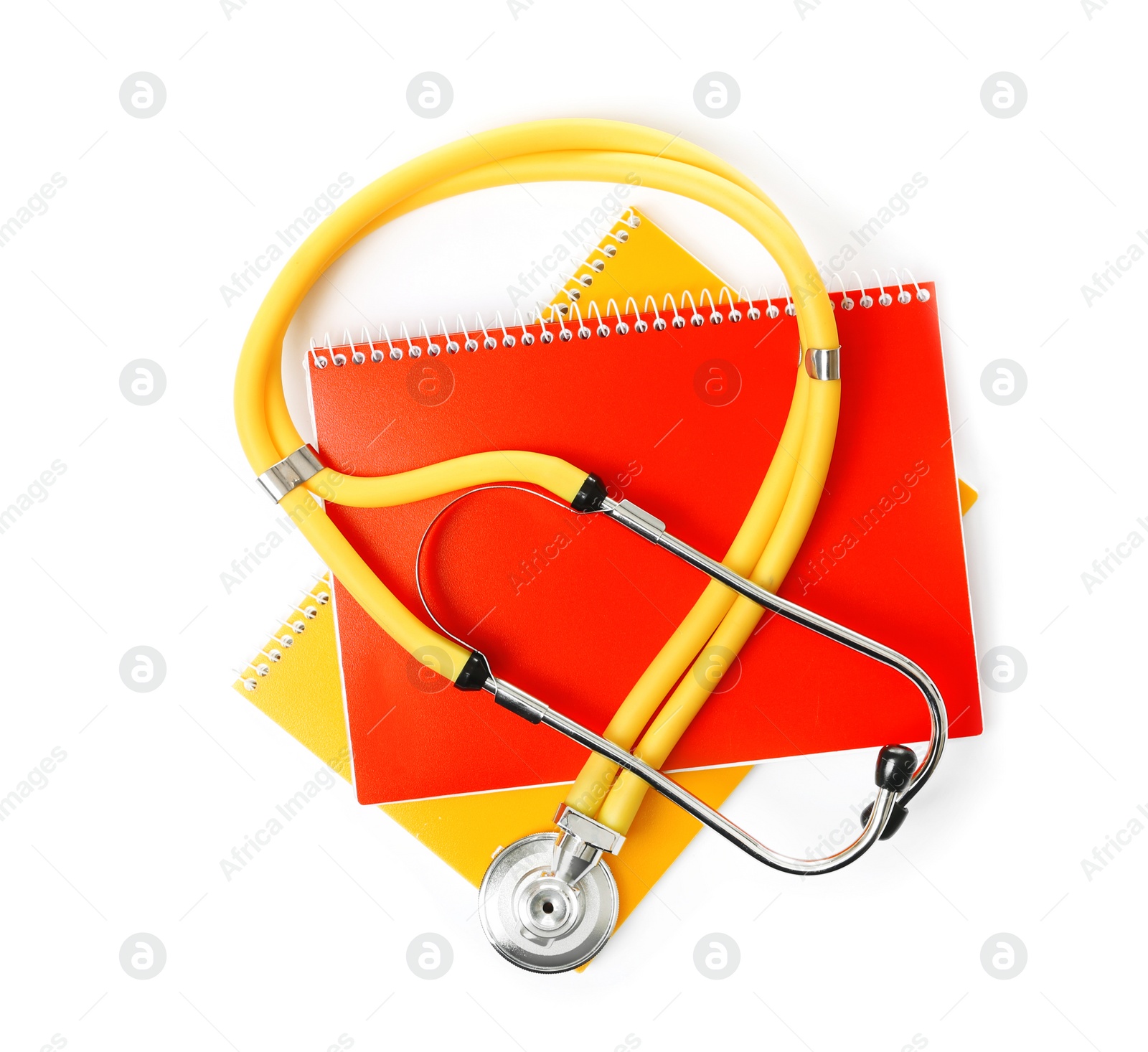 Photo of Stethoscope and notebooks on white background, top view. Medical students stuff