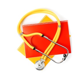 Stethoscope and notebooks on white background, top view. Medical students stuff