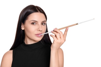 Photo of Woman using long cigarette holder for smoking isolated on white