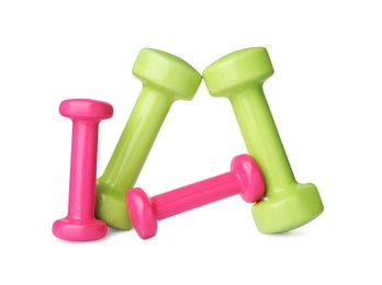 Photo of Colorful dumbbells on white background. Weight training equipment