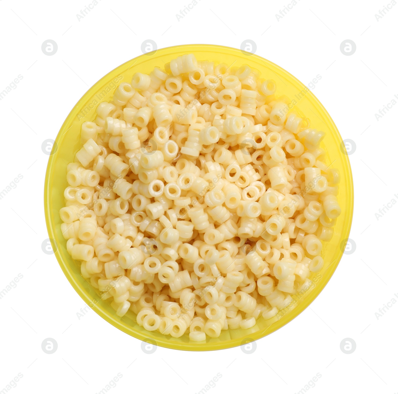 Photo of Yellow bowl with tasty pasta on white background, top view