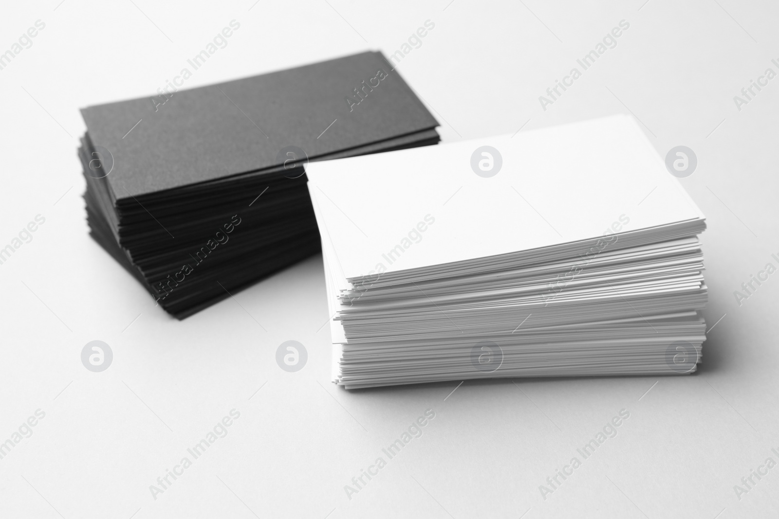 Photo of Blank business cards on white background, closeup. Mockup for design