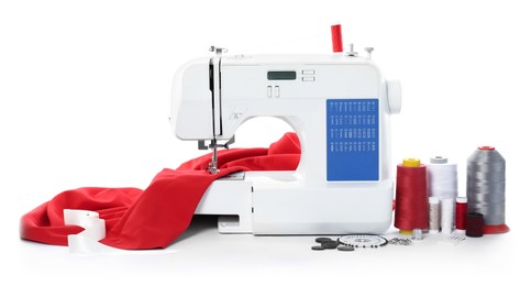 Photo of Sewing machine with fabric and craft accessories isolated on white