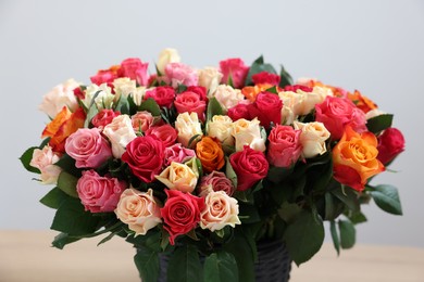 Photo of Bouquet of beautiful roses on light background