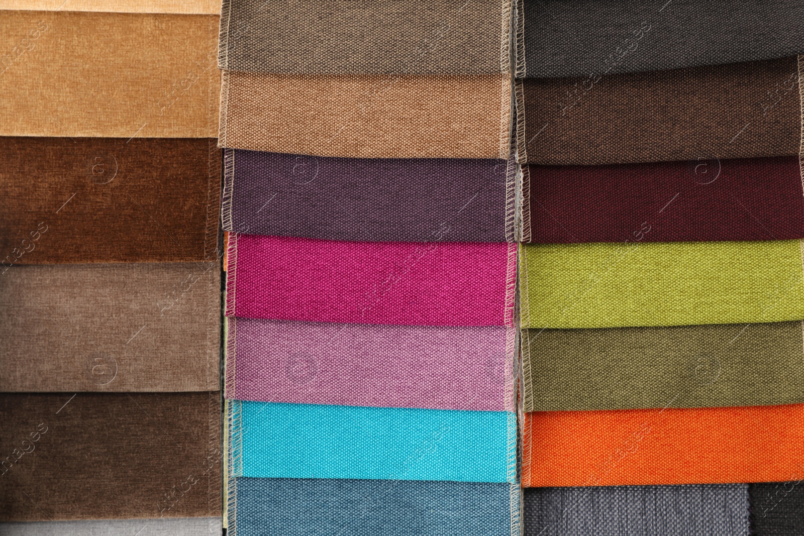 Photo of Fabric samples of different colors as background, top view