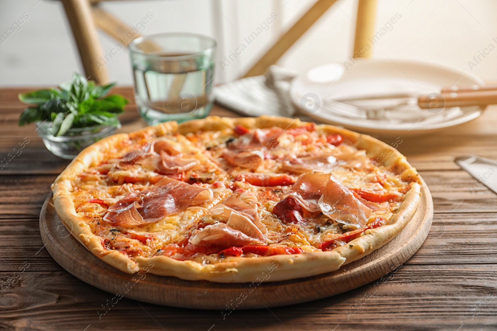 Photo of Delicious hot pizza with meat on table