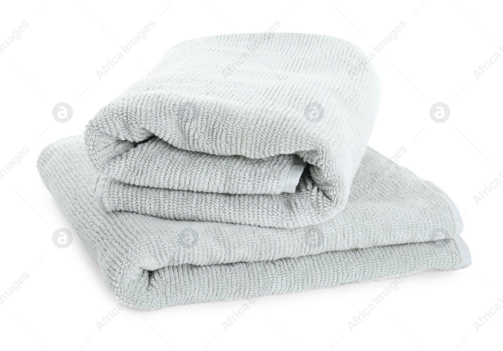 Photo of Soft folded terry towels isolated on white